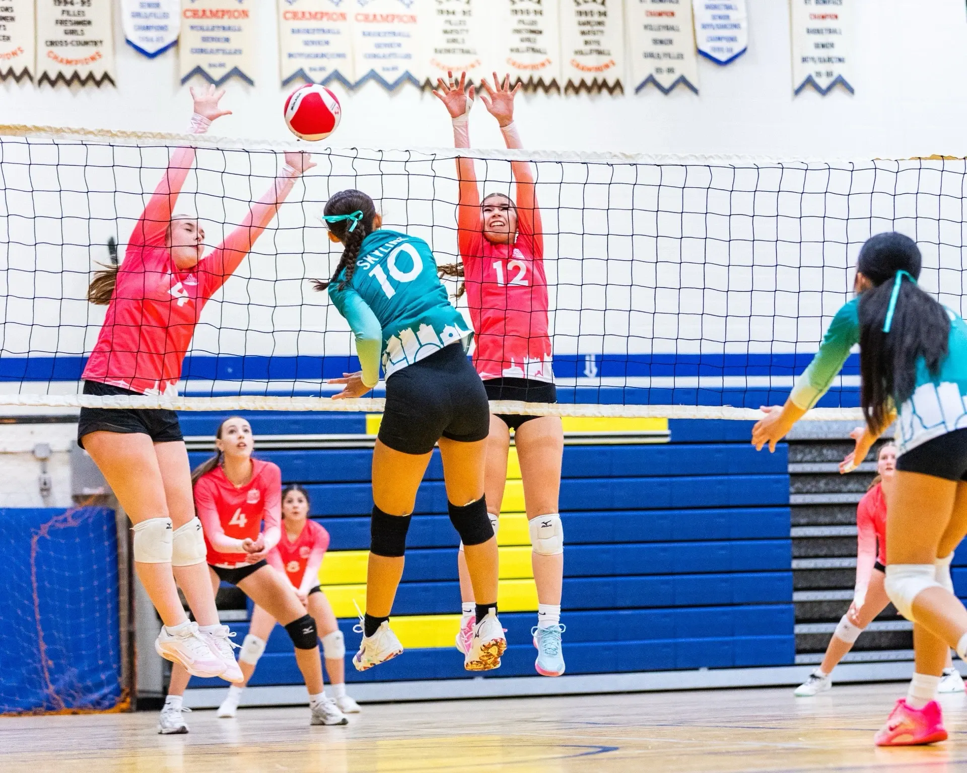 Skyline girls volleyball team celebrating together